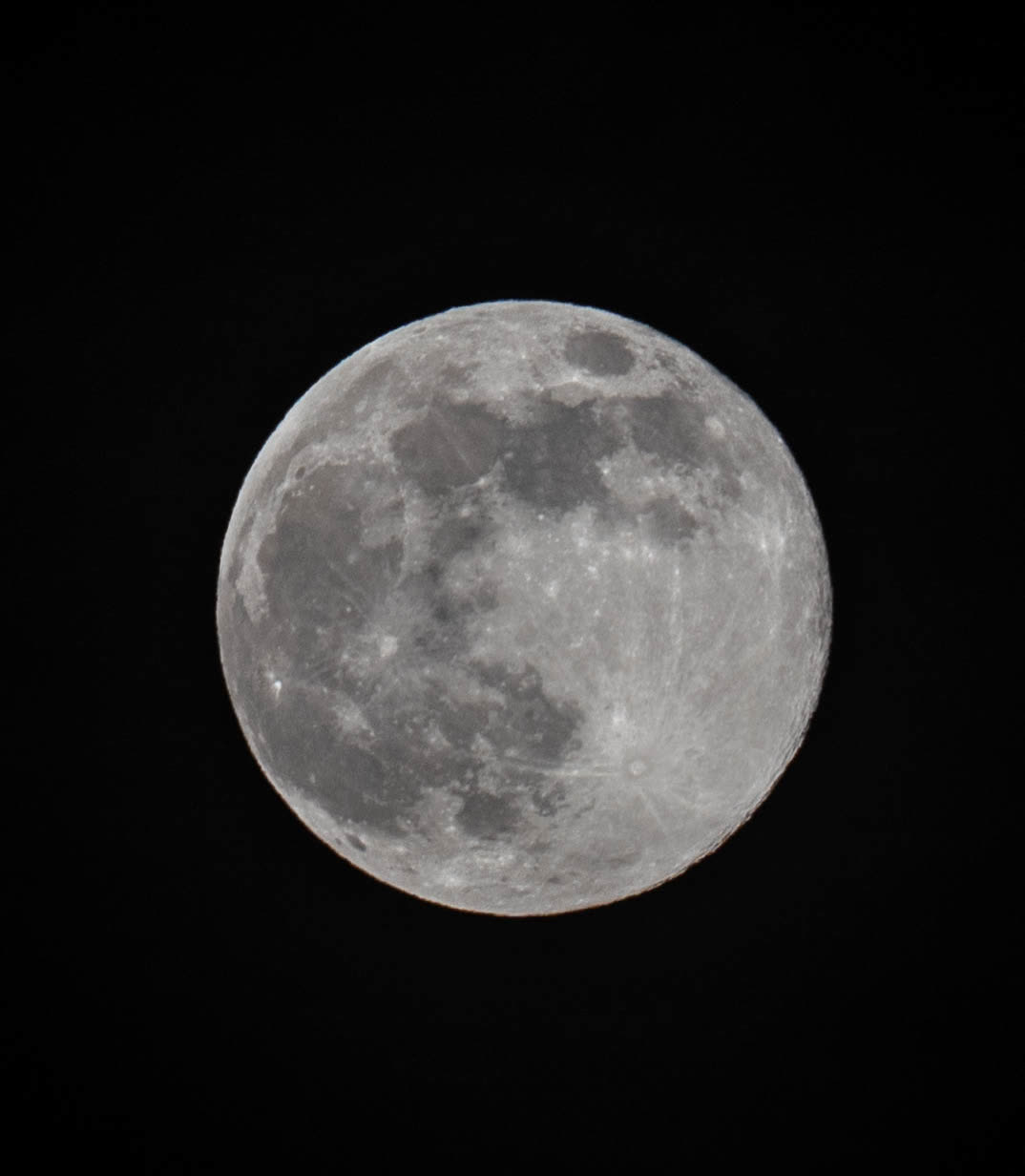 A full moon in sharp detail against a black sky